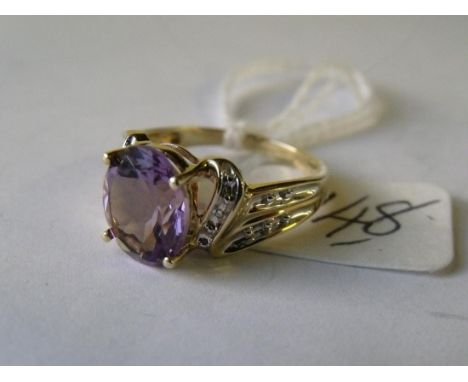 A good 9ct amethyst & diamond fancy ring  approx size 'N ½ '       