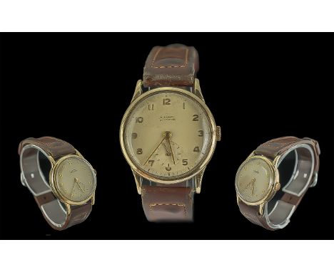 9ct Gold Gent's Manual Wind Wristwatch, gold case, champagne dial with Arabic numerals and subsidiary seconds.