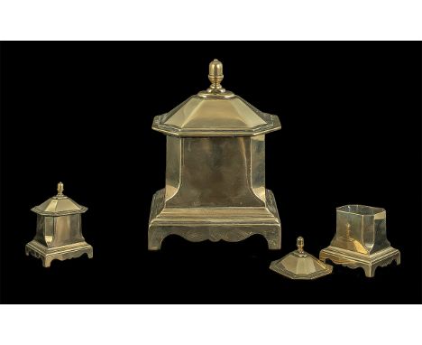 Brass Sarcophagus Shaped Lidded Tea Caddy,  raised on square feet and stepped base, measures 7'' high x 5'' wide.
