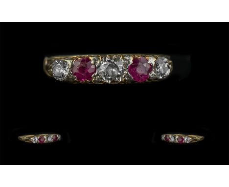 Ladies 18ct Gold and Platinum Attractive 5 Stone Diamond and Ruby Set Dress Ring. Marked 18ct and Platinum to Shank. The Rubi