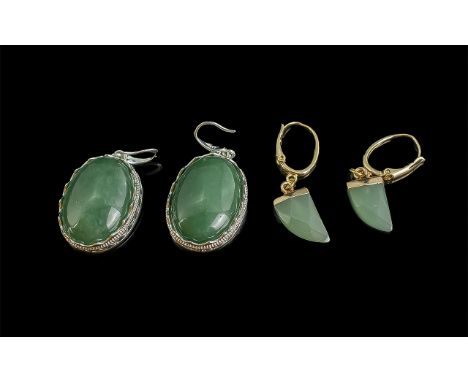 Pair of Jade Drop Earrings, for pierced ears, set in yellow metal, together with a pair of jade earrings, oval style set in w