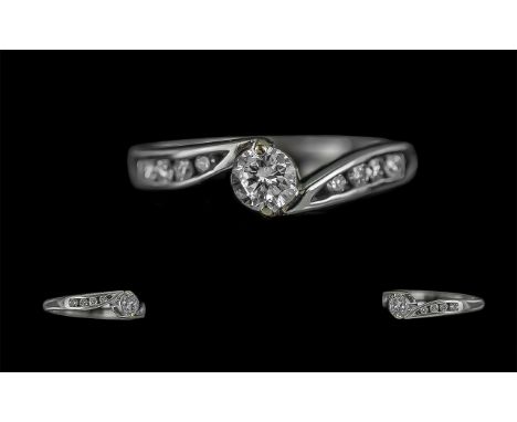 18ct White Gold Diamond Solitaire Twist Ring with diamond shoulders. Diamond weight 0.38ct approx. Ring size K.