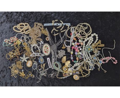 A Collection of of Vintage Costume Jewellery, including pearls, chains, brooches, bangles, rings etc.