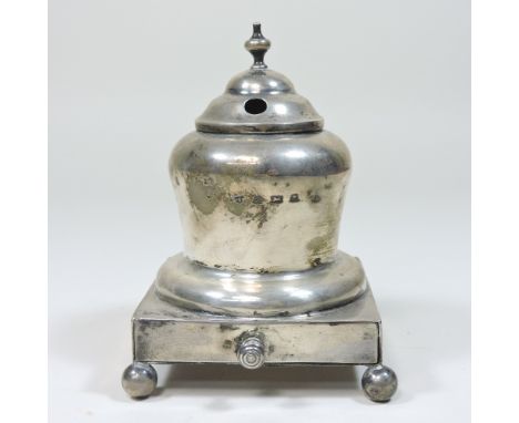 An early 20th century silver inkwell, of circular form, on a plinth base, Birmingham, marks rubbed, 12cm high