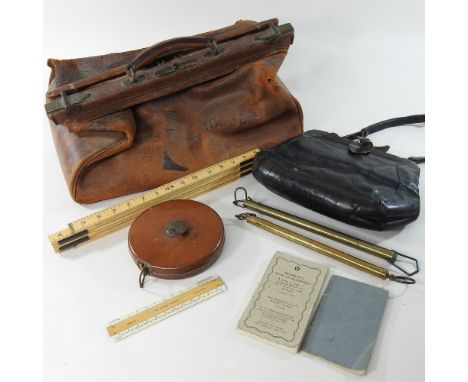 + An early 20th century leather Gladstone bag, by Harrods, containing various scales and tools, together with a 19th century 