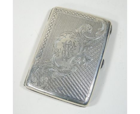 An Edwardian silver aide memoir, with engraved and engine turned decoration, a red leather fitted interior and silver pencil,