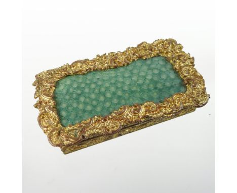 An ornate 19th century shagreen and gilt metal snuff box, with all over scrolled decoration, 7cm wide