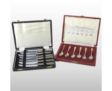 A mid 20th century set of silver teaspoons, British hall marks, cased, together with a set of six silver handled Queen Anne p