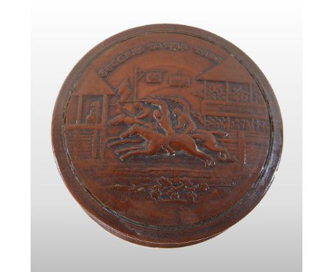 + A 19th century pressed treen snuff box, of circular shape, relief decorated with a horse race finish and inscribed 'Success