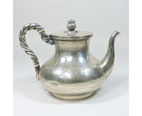 A Victorian silver teapot, of circular baluster form, with a ropetwist handle and hinged lid, engraved with a continuous frie