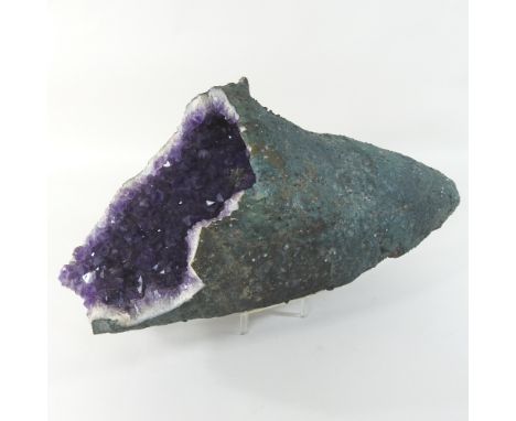 A large natural amethyst, 51cm long, on stand