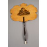 A Mauchline Ware fixed fan screen, the turned wood handle finished with a bone finial, the shaped