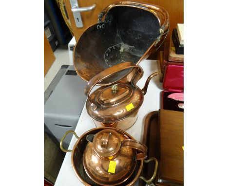 A good beaten copper helmet coal scuttle, a copper kettle and two further items of copper