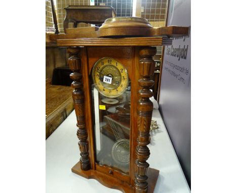 A Vienna-style wall clock and an oak encased barometer