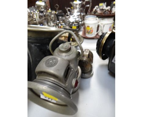 A vintage English motoring lamp and another