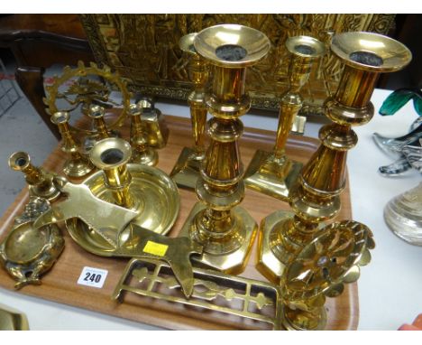 A parcel of brass ware including antique candlestick holders