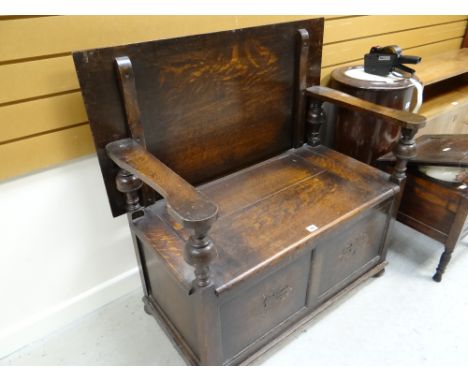 A dark oak monk's bench