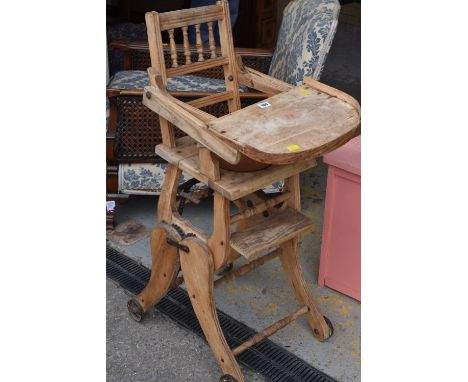 A lightwood vintage metamorphic child's chair