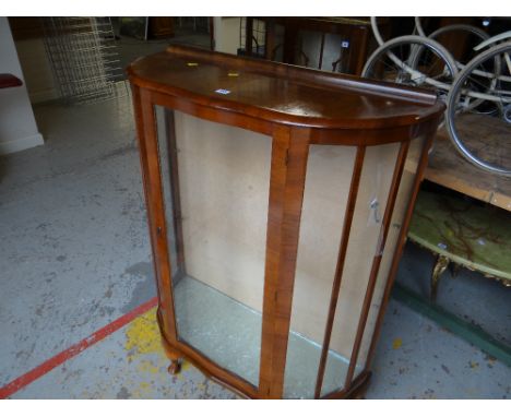 A polished glazed single door china cabinet