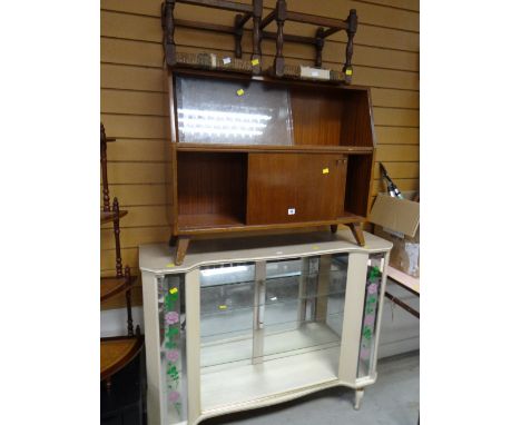 A kitsch vintage china cabinet with floral glass, a sliding door bookcase, two rush stools