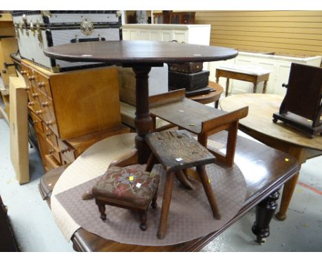 An antique circular tripod table, a small antique needlework stool, a rustic stool and mahogany dining table