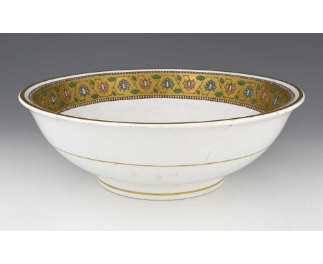 Christopher Dresser for Minton, an Aesthetic Movement bowl, 1866, footed with everted rim, decorated with a gilt band of pink