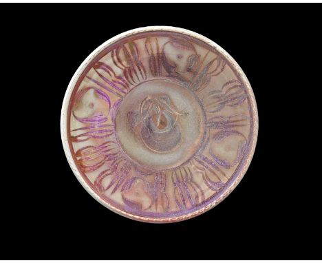 Alan Caiger-Smith for Aldermaston, a studio pottery lustre dish, 1973, circular form with gadrooned rim, painted with caligra