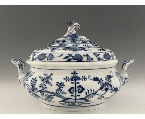 A Meissen onion pattern soup tureen, squat oval form with shell handles and scroll finial, 33.5cm long