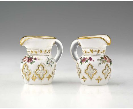 A pair of miniature Bohemian enamelled and flash cut glass jugs, 19th century, shouldered helmet form, white cased over colou