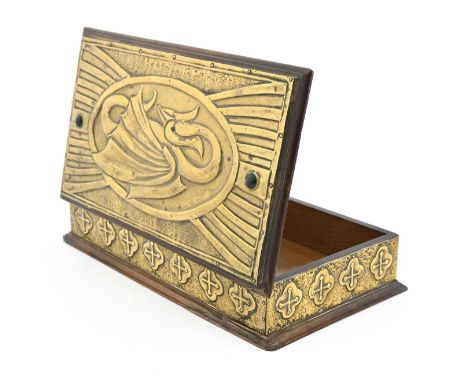 An Arts and Crafts brass clad box, the lid with a repousse embossed plaque of a stylised dragon within ribbed wing cartouche,