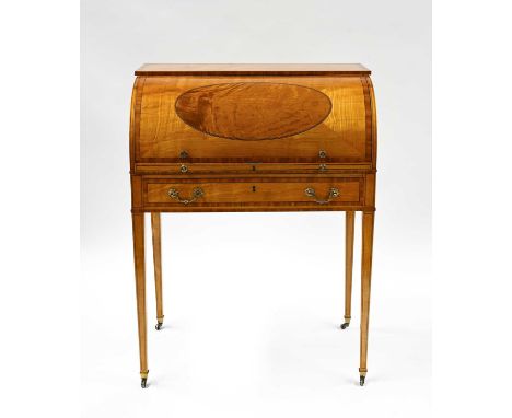 An Edwardian satinwood cylinder bureau, circa 1910, of Sheraton Revival design, crossbanded, ebony and boxwood strung through