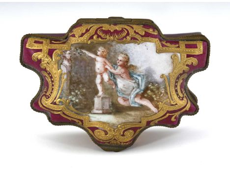 A porcelain trinket box in the Sevres style, late 19th Century, cartouche form with gilt metal mounts, the cover painted with