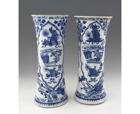 A pair of Chinese blue and white vases, leaf marks, waisted cylinder form, painted with ogee cartouches of auspicious symbols
