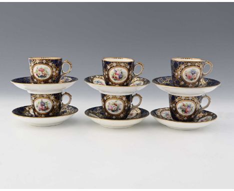 Six English porcelain tea cups and saucers, possibly Chamberlain's Worcester, floral bouquets within gilt and blue pummace gr