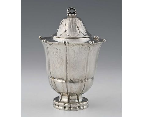 Georg Jensen, a Danish Skonvirke silver tea caddy, model 215, designed circa 1915, lobed Campana urn form with double beads t