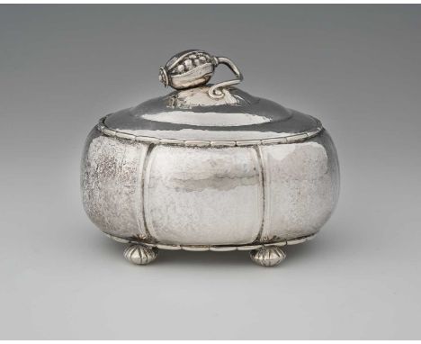 Georg Jensen, a Danish Skonvirke silver Poppy box and cover, model 186, designed circa 1915, oval section lobed poppy seed fo