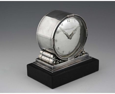 Johan Rohde for Georg Jensen, a Danish silver desk timepiece, model 596, the circular drum form case on a stepped platform ba