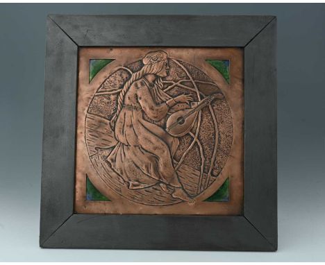 An Arts and Crafts copper and enamelled plaque, repousse embossed with a PreRaphaelite maiden playing a lute, the corners set