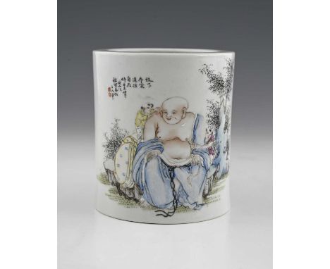 A Chinese polychrome brush pot, Qianlong mark, cylindrical form, painted with a Buddha type figure and boys in a garden lands