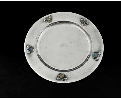 Archibald Knox for Liberty and Co, a Tudric Arts and Crafts pewter and abalone plate, model 0109, broad rimmed circular form 