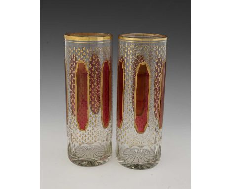 A pair of Bohemian gilt and ruby washed glass vases, cylindrical form, cute bordered canted panels within ermine and coral gr