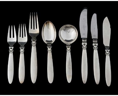 Gundorph Albertus for Georg Jensen, a suite of Cactus pattern eight-piece silver/steel place settings for six, designed circa