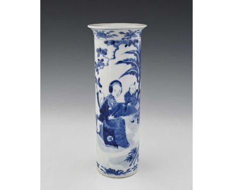 A Chinese blue and white sleeve vase, Kangxi mark, cylindrical form painted in the round with women and boys at a garden tabl