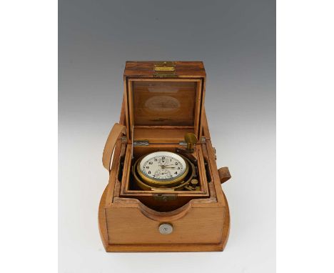A Russian Poljot marine chronometer, outer wooden case with leather buckle strap, triple-section inner case housing the brass
