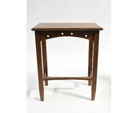 An Arts and Crafts oak side table, circa 1905, moulded rectangular top, circular fretwork frieze, block legs united by an inv