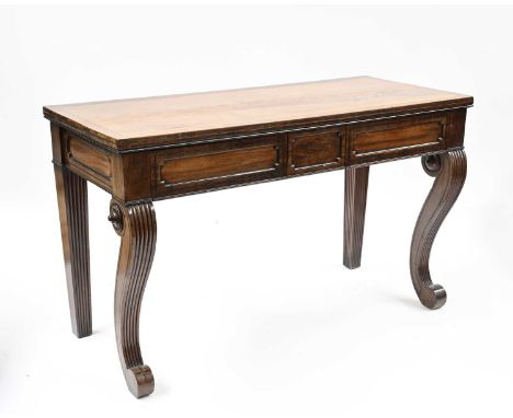 A Regency mahogany console table, circa 1820, crossbanded and strung flame mahogany top, breakfront frieze with twin panelled