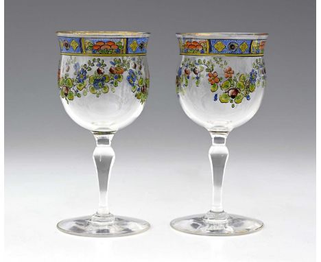 Hugo Masey for Webb Corbett, a pair of enamelled glass wine glasses, circa 1920s, the rounded bell form bowls pained with flo