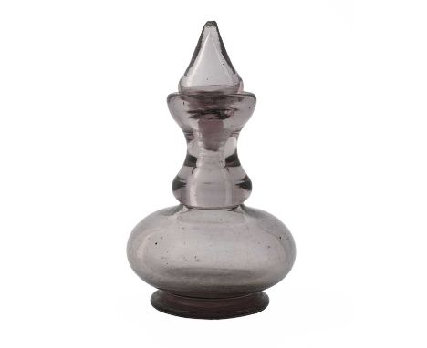 Baccarat, a 19th century amethyst glass scent bottle, circa 1850, footed double gour baluster form with hollow conical stoppe
