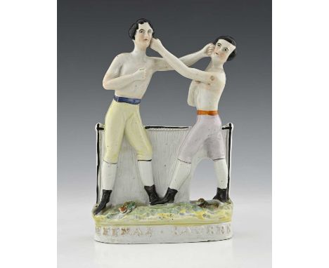 Staffordshire portrait pugilist figure group of 'Heenan' and 'Sayers, circa 1860, modelled as two shirtless boxing men, polyc