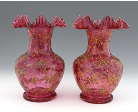 A pair of Bohemian enamelled ruby glass vases, circa 1890, baluster form with crimped rims, painted with stylised floral moti